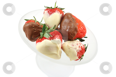To use this stock image in your creative project, please select the size you need over to the right and click the "Add to Cart" button.
Your downloaded image will come with the Cutcaster watermark removed so don’t worry about the watermark you see on this page. Chocolate Dipped Strawberries Overhead View stock photo, Milk and white chocolate dipped strawberries in a frosted glass bowl by Helen Shorey
