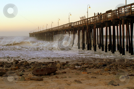 To use this stock image in your creative project, please select the size you need over to the right and click the "Add to Cart" button.
Your downloaded image will come with the Cutcaster watermark removed so don’t worry about the watermark you see on this page. Ocean Wave Storm Pier stock photo, Ocean waves throughout at storm crashing into a wooden pier. by Henrik Lehnerer
