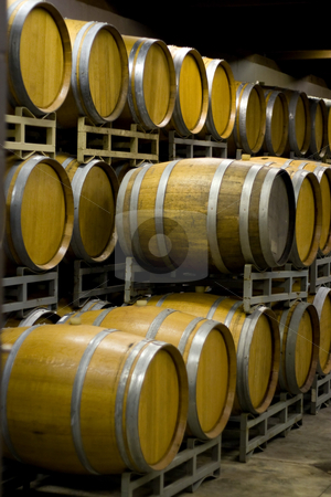 To use this stock image in your creative project, please select the size you need over to the right and click the "Add to Cart" button.
Your downloaded image will come with the Cutcaster watermark removed so don’t worry about the watermark you see on this page. Winery Cellar Barrels stock photo, A vineyard cellar where barrels of wine age in stacked rows. by Todd Arena