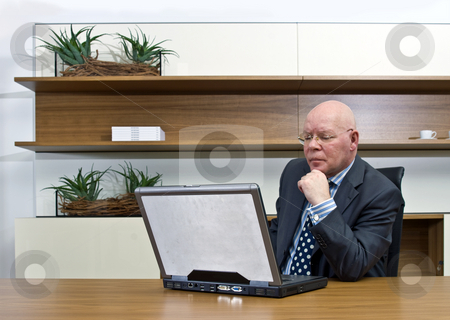 To use this stock image in your creative project, please select the size you need over to the right and click the "Add to Cart" button.
Your downloaded image will come with the Cutcaster watermark removed so don’t worry about the watermark you see on this page. Thinking manager stock photo, A manager thinking hard behind a laptop by Corepics VOF