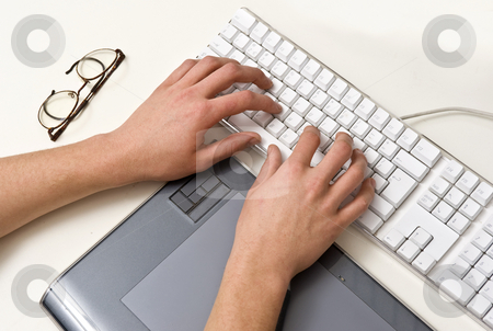 To use this stock image in your creative project, please select the size you need over to the right and click the "Add to Cart" button.
Your downloaded image will come with the Cutcaster watermark removed so don’t worry about the watermark you see on this page. Typing Hands stock photo, Two typing hands on a white keyboard, with a pair of glasses and a tablet, situated in an office environment by Corepics VOF