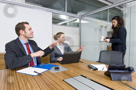 To use this stock image in your creative project, please select the size you need over to the right and click the "Add to Cart" button.
Your downloaded image will come with the Cutcaster watermark removed so don’t worry about the watermark you see on this page. Longing for Coffee stock photo, Two colleagues longing for the coffee a third person brings in during a long meeting by Corepics VOF