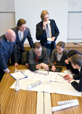 To use this stock image in your creative project, please select the size you need over to the right and click the "Add to Cart" button.
Your downloaded image will come with the Cutcaster watermark removed so don’t worry about the watermark you see on this page. Design Team Meeting stock photo, Seven people gathering around the architectural plans, discussing the design in an office cubicle by Corepics VOF