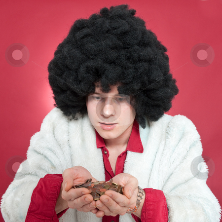 To use this stock image in your creative project, please select the size you need over to the right and click the "Add to Cart" button.
Your downloaded image will come with the Cutcaster watermark removed so don’t worry about the watermark you see on this page. Pimp stock photo, Pimp looking at his hands filled with coins. by Corepics VOF
