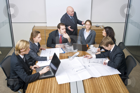 To use this stock image in your creative project, please select the size you need over to the right and click the "Add to Cart" button.
Your downloaded image will come with the Cutcaster watermark removed so don’t worry about the watermark you see on this page. Business team meeting stock photo, A business team going over the design changes at a corporate architectural firm by Corepics VOF
