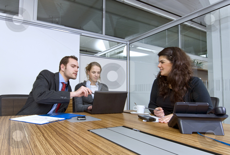To use this stock image in your creative project, please select the size you need over to the right and click the "Add to Cart" button.
Your downloaded image will come with the Cutcaster watermark removed so don’t worry about the watermark you see on this page. Small business team stock photo, A small business team in a cubicle conference room during a meeting by Corepics VOF