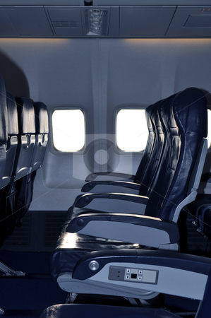 To use this stock image in your creative project, please select the size you need over to the right and click the "Add to Cart" button.
Your downloaded image will come with the Cutcaster watermark removed so don’t worry about the watermark you see on this page. Airliner passenger cabin stock photo, Row of empty seats in commercial aircraft cabin by Fernando Barozza