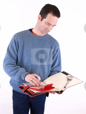 To use this stock image in your creative project, please select the size you need over to the right and click the "Add to Cart" button.
Your downloaded image will come with the Cutcaster watermark removed so don’t worry about the watermark you see on this page. Working on Measurements stock photo, An adult male in blue checks over some measurements in a binder. Isolated on a white background. by Robert Gebbie