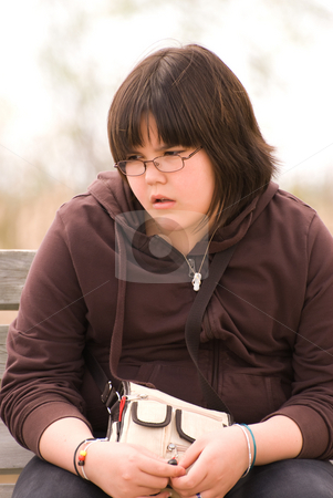 To use this stock image in your creative project, please select the size you need over to the right and click the "Add to Cart" button.
Your downloaded image will come with the Cutcaster watermark removed so don’t worry about the watermark you see on this page. Bored Child stock photo, A young girl sitting outside with a bored or depressed look on her face by Richard Nelson
