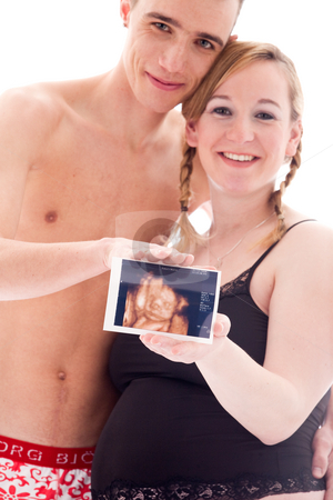 To use this stock image in your creative project, please select the size you need over to the right and click the "Add to Cart" button.
Your downloaded image will come with the Cutcaster watermark removed so don’t worry about the watermark you see on this page. Our echogram of our unborn child stock photo, Young lovely caucasian couple expecting their baby by Frenk and Danielle Kaufmann