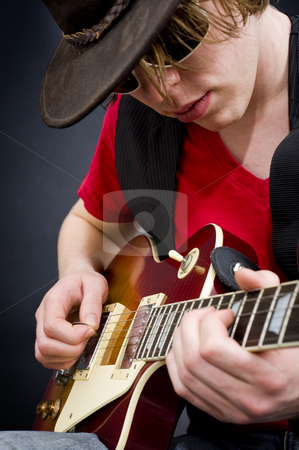 To use this stock image in your creative project, please select the size you need over to the right and click the "Add to Cart" button.
Your downloaded image will come with the Cutcaster watermark removed so don’t worry about the watermark you see on this page. Blues musician stock photo, A blues guitarist playing a tune on his instrument by Corepics VOF