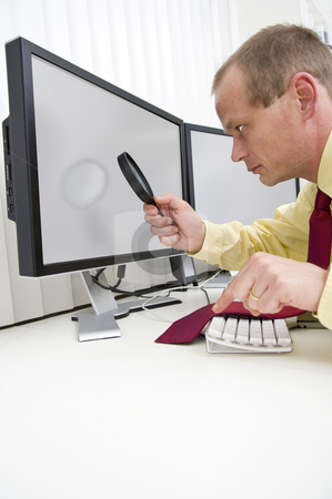 To use this stock image in your creative project, please select the size you need over to the right and click the "Add to Cart" button.
Your downloaded image will come with the Cutcaster watermark removed so don’t worry about the watermark you see on this page. Analyzing computer data stock photo, Businessman seriously analyzing data on a computer monitor using a magnifying glass, with his left index finger hovering above the escape key to interrupt the process.
clipping path of the monitors is included at the maximum resolution of the image by Corepics VOF