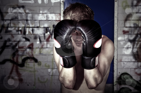 To use this stock image in your creative project, please select the size you need over to the right and click the "Add to Cart" button.
Your downloaded image will come with the Cutcaster watermark removed so don’t worry about the watermark you see on this page. Block stock photo, The block of a boxer, showing self protection in a graffiti clad basement by Corepics VOF