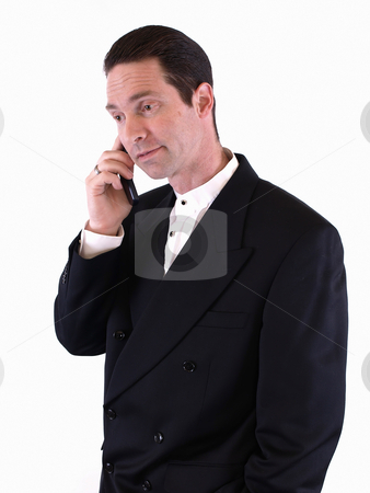 To use this stock image in your creative project, please select the size you need over to the right and click the "Add to Cart" button.
Your downloaded image will come with the Cutcaster watermark removed so don’t worry about the watermark you see on this page. Taking a Call stock photo, A man in a black suit takes a phone call on his cell. Isolated over white. by Robert Gebbie