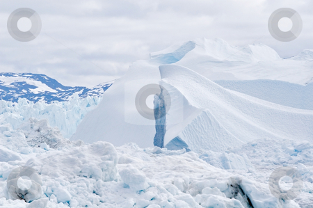 To use this stock image in your creative project, please select the size you need over to the right and click the "Add to Cart" button.
Your downloaded image will come with the Cutcaster watermark removed so don’t worry about the watermark you see on this page. Iceberg #7 stock photo, Beautiful icebergs and curves. Almost look like sand dunes.