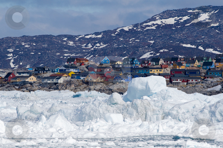 To use this stock image in your creative project, please select the size you need over to the right and click the "Add to Cart" button.
Your downloaded image will come with the Cutcaster watermark removed so don’t worry about the watermark you see on this page. Ilulissat, Greenland, seen from the sea stock photo, The city of Ilulissat, Greenland. The picture i taken from a tour boats going in between the icebergs by Anders Peter