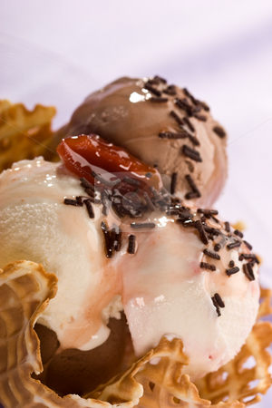 To use this stock image in your creative project, please select the size you need over to the right and click the "Add to Cart" button.
Your downloaded image will come with the Cutcaster watermark removed so don’t worry about the watermark you see on this page. ice cream stock photo, Close up ice cream with chocolate knick knackery by Gennady Kravetsky