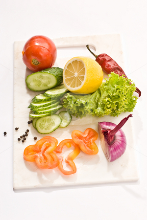 To use this stock image in your creative project, please select the size you need over to the right and click the "Add to Cart" button.
Your downloaded image will come with the Cutcaster watermark removed so don’t worry about the watermark you see on this page. Vegetarian diet stock photo, Vegetable mix: lettuce, onion, lemon, cucumber on the board by Gennady Kravetsky