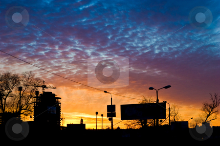 To use this stock image in your creative project, please select the size you need over to the right and click the "Add to Cart" button.
Your downloaded image will come with the Cutcaster watermark removed so don’t worry about the watermark you see on this page. City sunset stock photo, City series: cloudy sunset on the modern city by Gennady Kravetsky