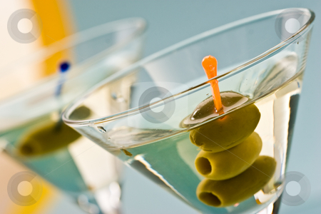 To use this stock image in your creative project, please select the size you need over to the right and click the "Add to Cart" button.
Your downloaded image will come with the Cutcaster watermark removed so don’t worry about the watermark you see on this page. Martini stock photo, One bocal of martini with olive over blue by Gennady Kravetsky