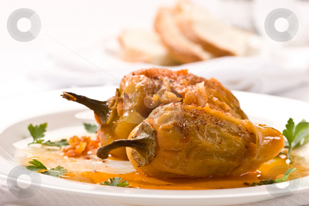 To use this stock image in your creative project, please select the size you need over to the right and click the "Add to Cart" button.
Your downloaded image will come with the Cutcaster watermark removed so don’t worry about the watermark you see on this page. Stuffed peppers stock photo, Food series: stuffed peppers on the plate by Gennady Kravetsky