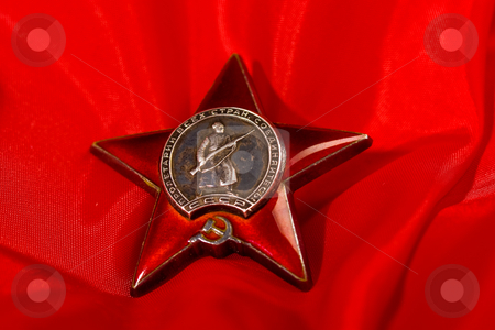 To use this stock image in your creative project, please select the size you need over to the right and click the "Add to Cart" button.
Your downloaded image will come with the Cutcaster watermark removed so don’t worry about the watermark you see on this page. Medal stock photo, Honour series: star medal over red background by Gennady Kravetsky