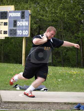 To use this stock image in your creative project, please select the size you need over to the right and click the "Add to Cart" button.
Your downloaded image will come with the Cutcaster watermark removed so don’t worry about the watermark you see on this page. Shot Put Wind Up stock photo, Local Track and Field Event between rivals Columbia River High School and visiting team Hudson?? by Robert Gebbie