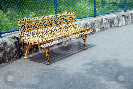 To use this stock image in your creative project, please select the size you need over to the right and click the "Add to Cart" button.
Your downloaded image will come with the Cutcaster watermark removed so don’t worry about the watermark you see on this page. Bench in animal design stock photo, Yellow spotted bench in animal design in park outdoor by Julija Sapic