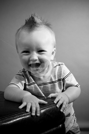 To use this stock image in your creative project, please select the size you need over to the right and click the "Add to Cart" button.
Your downloaded image will come with the Cutcaster watermark removed so don’t worry about the watermark you see on this page. Nine Month Old Boy stock photo, A portrait of a cute nine month old baby boy. by Travis Manley