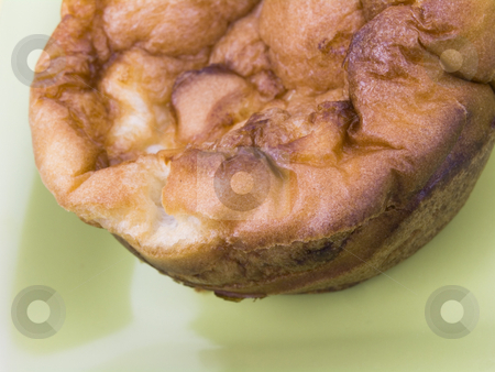 To use this stock image in your creative project, please select the size you need over to the right and click the "Add to Cart" button.
Your downloaded image will come with the Cutcaster watermark removed so don’t worry about the watermark you see on this page. Yorkshire Pudding stock photo, Close up of Yorkshire pudding on a green plate by John Teeter