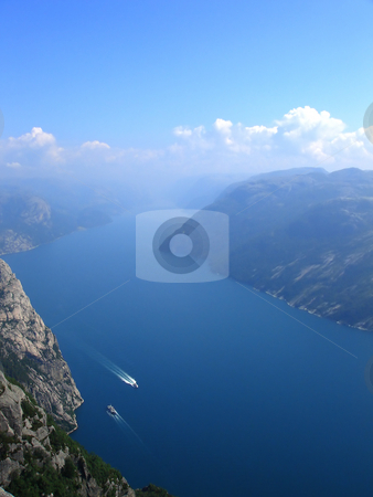 To use this stock image in your creative project, please select the size you need over to the right and click the "Add to Cart" button.
Your downloaded image will come with the Cutcaster watermark removed so don’t worry about the watermark you see on this page. Norwegian fjord stock photo, Beautiful view of the Norwegian fjord - nord europe by Stelian Ion