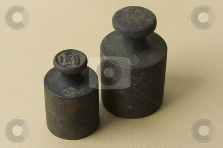 To use this stock image in your creative project, please select the size you need over to the right and click the "Add to Cart" button.
Your downloaded image will come with the Cutcaster watermark removed so don’t worry about the watermark you see on this page. Two iron weights stock photo, Two old iron weights on beige background by Andreas Brenner