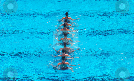To use this stock image in your creative project, please select the size you need over to the right and click the "Add to Cart" button.
Your downloaded image will come with the Cutcaster watermark removed so don’t worry about the watermark you see on this page. Synchronized Swimming Team stock photo, A seven women synchronized swimming team performing. by Denis Radovanovic