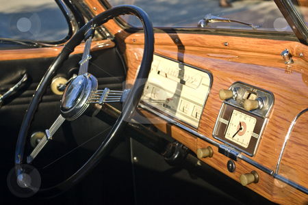 To use this stock image in your creative project, please select the size you need over to the right and click the "Add to Cart" button.
Your downloaded image will come with the Cutcaster watermark removed so don’t worry about the watermark you see on this page. Antique Car Dashboard stock photo, Dashboard of an antique convertible car. by Steve Carroll