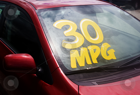 To use this stock image in your creative project, please select the size you need over to the right and click the "Add to Cart" button.
Your downloaded image will come with the Cutcaster watermark removed so don’t worry about the watermark you see on this page. 30 MPG stock photo, Car dealer displaying hight miles per gallon on new cars. by Steve Carroll