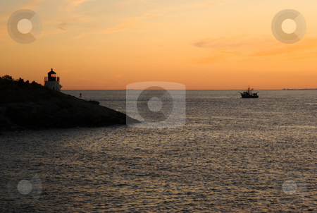 To use this stock image in your creative project, please select the size you need over to the right and click the "Add to Cart" button.
Your downloaded image will come with the Cutcaster watermark removed so don’t worry about the watermark you see on this page. Sunset Ship and Lighthouse stock photo, Silhouette of a cargo ship passing the lit Castle Hill lighthouse at sunset. by Daniel Rosner