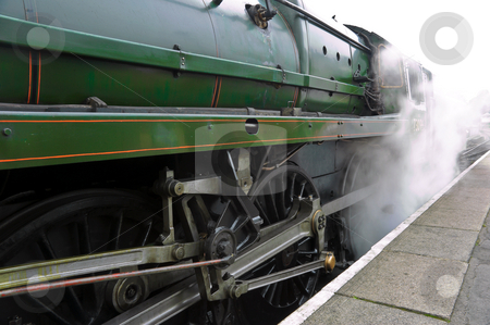 To use this stock image in your creative project, please select the size you need over to the right and click the "Add to Cart" button.
Your downloaded image will come with the Cutcaster watermark removed so don’t worry about the watermark you see on this page. Releasing Steam stock photo, Old steam train engine releasing steam at alton station by Robert Ford