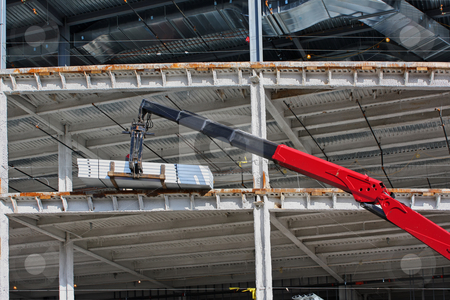 To use this stock image in your creative project, please select the size you need over to the right and click the "Add to Cart" button.
Your downloaded image will come with the Cutcaster watermark removed so don’t worry about the watermark you see on this page. Lift supplying materials at a new construction site stock photo, Lift supplying materials to a worker at a new construction site with steel girders and blue sky by Stephen Goodwin