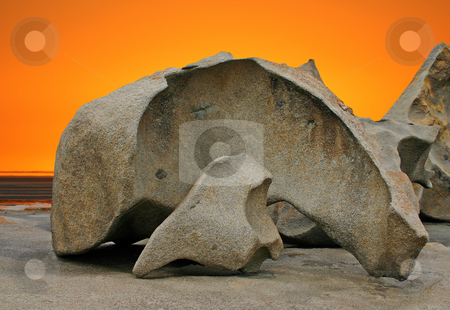 To use this stock image in your creative project, please select the size you need over to the right and click the "Add to Cart" button.
Your downloaded image will come with the Cutcaster watermark removed so don’t worry about the watermark you see on this page. Sculpted rock formation and orange sky stock photo, Sculpted rock formation and orange sky at Remarkable Rocks in Flinders Chase National Park, Kangaroo Island, South Australia by Stephen Goodwin