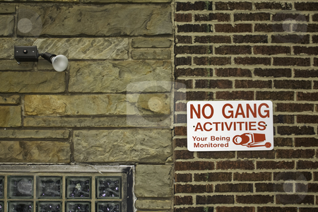 To use this stock image in your creative project, please select the size you need over to the right and click the "Add to Cart" button.
Your downloaded image will come with the Cutcaster watermark removed so don’t worry about the watermark you see on this page. No gang activities sign stock photo, No gang activities sign against red brick and stone walls with security light by Stephen Goodwin