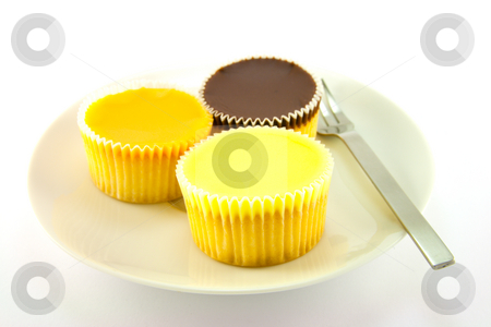 To use this stock image in your creative project, please select the size you need over to the right and click the "Add to Cart" button.
Your downloaded image will come with the Cutcaster watermark removed so don’t worry about the watermark you see on this page. Three Cup Cakes stock photo, Three delicious looking cup cakes resting on a white plate with a fork on a plain background by Keith Wilson