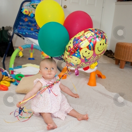 To use this stock image in your creative project, please select the size you need over to the right and click the "Add to Cart" button.
Your downloaded image will come with the Cutcaster watermark removed so don’t worry about the watermark you see on this page. Balloons stock photo, Caucasian baby girl playing with colorful balloons on a floor. by Mariusz Jurgielewicz
