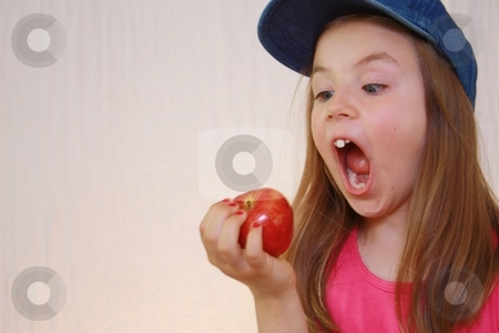 To use this stock image in your creative project, please select the size you need over to the right and click the "Add to Cart" button.
Your downloaded image will come with the Cutcaster watermark removed so don’t worry about the watermark you see on this page. Young girl about to bite red apple. stock photo, Young girl about to bite apple by Gregory Dean