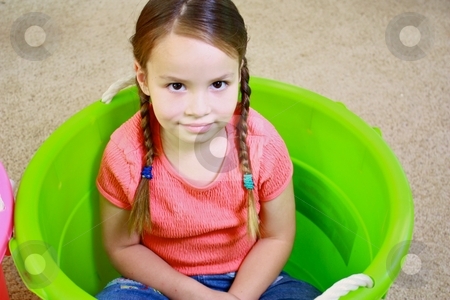 To use this stock image in your creative project, please select the size you need over to the right and click the "Add to Cart" button.
Your downloaded image will come with the Cutcaster watermark removed so don’t worry about the watermark you see on this page. Young cute girl playing in green bucket stock photo, Young girl playing by Gregory Dean