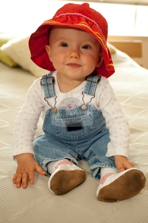 To use this stock image in your creative project, please select the size you need over to the right and click the "Add to Cart" button.
Your downloaded image will come with the Cutcaster watermark removed so don’t worry about the watermark you see on this page. Red Hat stock photo, Cute little caucasian baby girl wearing red hat and sitting on a bed. by Mariusz Jurgielewicz