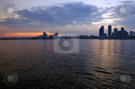 To use this stock image in your creative project, please select the size you need over to the right and click the "Add to Cart" button.
Your downloaded image will come with the Cutcaster watermark removed so don’t worry about the watermark you see on this page. Toronto skyline stock photo, Toronto skyline from Ontario lake in time of sunset by Pavel Cheiko