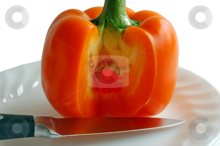 To use this stock image in your creative project, please select the size you need over to the right and click the "Add to Cart" button.
Your downloaded image will come with the Cutcaster watermark removed so don’t worry about the watermark you see on this page. Paprika stock photo, Orange paprika with knife on the plate by Pavel Cheiko