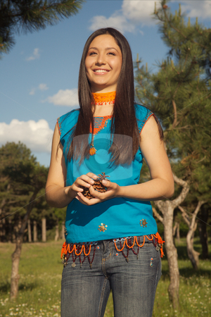 To use this stock image in your creative project, please select the size you need over to the right and click the "Add to Cart" button.
Your downloaded image will come with the Cutcaster watermark removed so don’t worry about the watermark you see on this page. Asian beauty stock photo, Portrait of the beautiful girl on a background of green trees. by Sergey Goruppa
