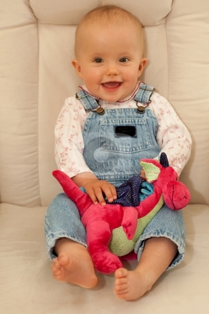 To use this stock image in your creative project, please select the size you need over to the right and click the "Add to Cart" button.
Your downloaded image will come with the Cutcaster watermark removed so don’t worry about the watermark you see on this page. Sitting on a chair stock photo, Little caucasian baby girl sitting on a chair. by Mariusz Jurgielewicz