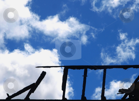 To use this stock image in your creative project, please select the size you need over to the right and click the "Add to Cart" button.
Your downloaded image will come with the Cutcaster watermark removed so don’t worry about the watermark you see on this page. Fire Damaged stock photo, Silhouette of Charred Wall against a cloudy sky by Margo Harrison